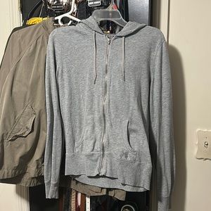 Woman’s gray zip up Victorias secret sweater
